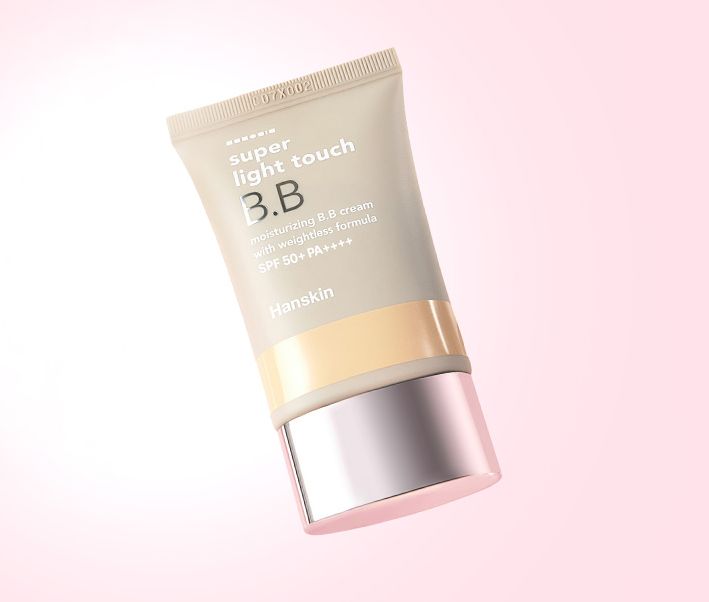ProtoClinical k-beauty warm beige beauty graphic with a soft centered taupe form on a pale cream and blush background.