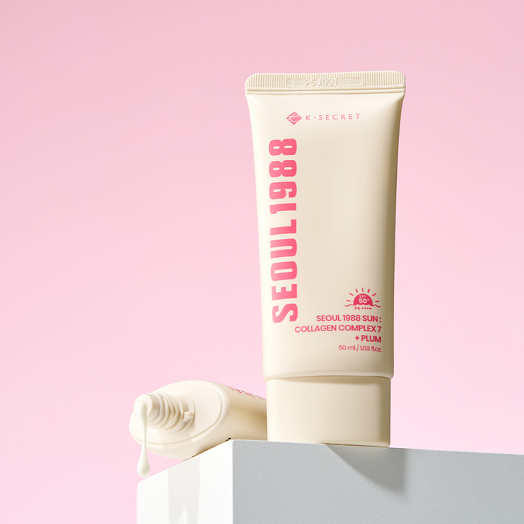 ProtoClinical k-beauty K-SECRET SEOUL 1988 SUN : COLLAGEN COMPLEX 7 + PLUM 50ml product packaging on a soft pink background.
