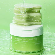 ProtoClinical k-beauty soft green beauty product silhouette with a darker center on a pale green background.