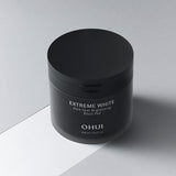 ProtoClinical k-beauty dark beauty product packaging on a light neutral background.