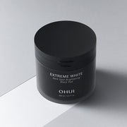 ProtoClinical k-beauty dark beauty product packaging on a light neutral background.