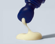 ProtoClinical k-beauty blue-violet beauty product centered on a soft gray background.