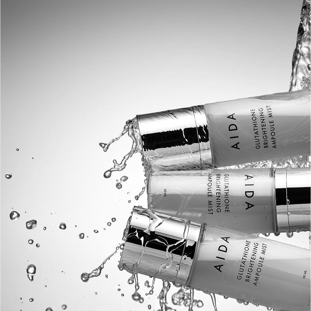 AIDA Glutathione Brightnening Ampoule Mist 60ml by ProtoClinical shown in a front-facing skincare packshot on a white background, highlighting bright mist bottle packaging for a k-beauty routine.