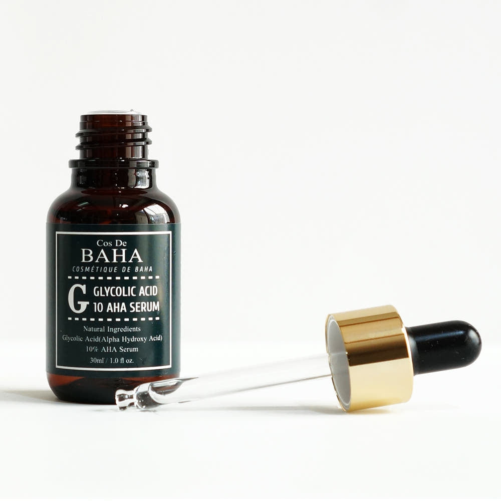 ProtoClinical k-beauty Cos De BAHA G Glycolic Acid 10% AHA Serum 30ml dark serum bottle with matching box side by side on a white background