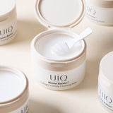 ProtoClinical k-beauty soft beige beauty detail with three muted circular forms on a pale blue background.