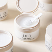 ProtoClinical k-beauty soft beige beauty detail with three muted circular forms on a pale blue background.