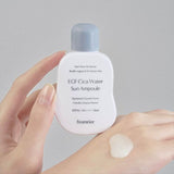 ProtoClinical k-beauty soft beige beauty detail on a muted blue and taupe background.