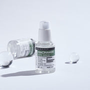 ProtoClinical k-beauty DERMA FACTORY Niacinamide 20% Serum 30ml shown as a single upright serum bottle centered on a pale gray background