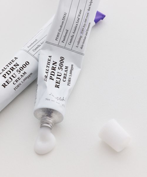 ProtoClinical k-beauty pale lavender beauty graphic with a soft diagonal form on a light background.