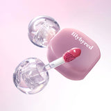 ProtoClinical k-beauty lilybyred Balming Dewy Tint 6g (6colors) single rounded lip tint bottle shown upright with a glossy pink cap on a soft pink background