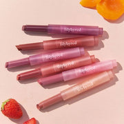 ProtoClinical k-beauty lilybyred Milky Blur Fondue Bar 1.9g (6colors) multiple pink and berry cylindrical balm sticks arranged together in a close-up product set on a light peach background