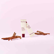 ProtoClinical k-beauty soft lilac and beige beauty graphic with a muted darker center on a light background.