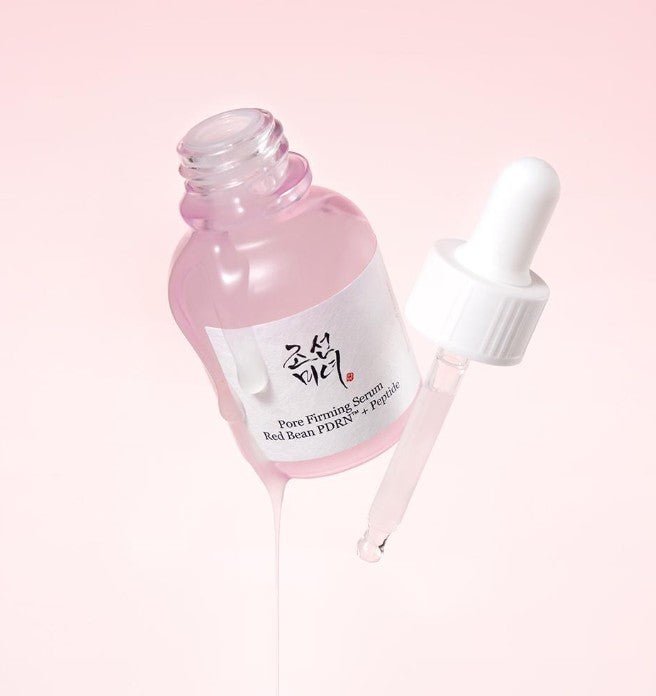 ProtoClinical k-beauty [Beauty of Joseon] Pore Firming Serum (Red Bean PDRN+Peptide) 30ml open pink serum bottle with a detached white dropper and glossy serum drips on a pale pink background