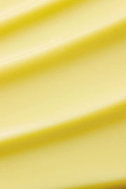 ProtoClinical k-beauty minimalist yellow beauty graphic with soft horizontal bands on a pale background.