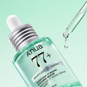 ProtoClinical k-beauty Anua Heartleaf 77 B3Zinc Soothing Serum 30ml angled mint green serum bottle with a glass dropper releasing a droplet on a pale green background