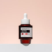 ProtoClinical k-beauty heimish RX AHA BHA Peeling Serum 35ml with three dark red serum bottles, including one upright bottle and one tilted inside a clear water beaker on a white background