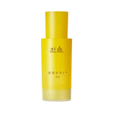 ProtoClinical k-beauty HANYUL Moonlight Yuja C Serum 30ml single upright yellow serum bottle centered on a pale blue background