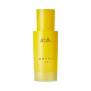 ProtoClinical k-beauty HANYUL Moonlight Yuja C Serum 30ml single upright yellow serum bottle centered on a pale blue background