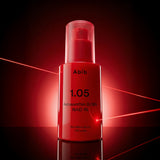 ProtoClinical k-beauty Abib Red Effect Serum 1.05 Pump 30ml single deep pink pump bottle centered on a black background with soft red reflections