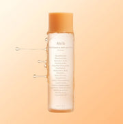 ProtoClinical k-beauty soft peach beauty graphic with a muted beige accent on a light background.