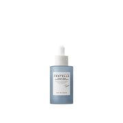 ProtoClinical k-beauty SKIN1004 Hyalu-Teca Plumping Ampoule 50ml abstract product graphic with an upright pale blue bottle-like silhouette, dark gray oval center, and soft blue side bands on a white background