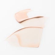 ProtoClinical k-beauty soft peach beauty graphic with pale blue side shading on a light background.