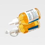 ProtoClinical k-beauty Dr.Melaxin TX Ampoule Cleanser 100ml single centered pale yellow cleanser container on a pale blue and cream background.