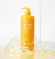 ProtoClinical k-beauty tall golden beauty product silhouette with soft pale blue side accents on a light background.