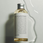 ProtoClinical k-beauty dark olive beauty product silhouette with pale sage and warm beige side panels on a light background.