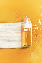 ProtoClinical k-beauty warm golden beauty graphic with a soft cream horizontal band on a rich yellow background.
