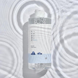 ProtoClinical k-beauty ROUND LAB 1025 Dokdo Cleansing Water 400mL single cleansing water bottle on a light background