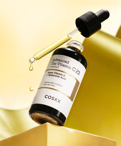 ProtoClinical k-beauty COSRX The Vitamin C 23 Serum 20ml single centered serum bottle with a dark cap on a pale yellow and cream background