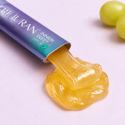 Close-up of translucent golden REJURAN Inner Dot jelly texture from a single-serve stick