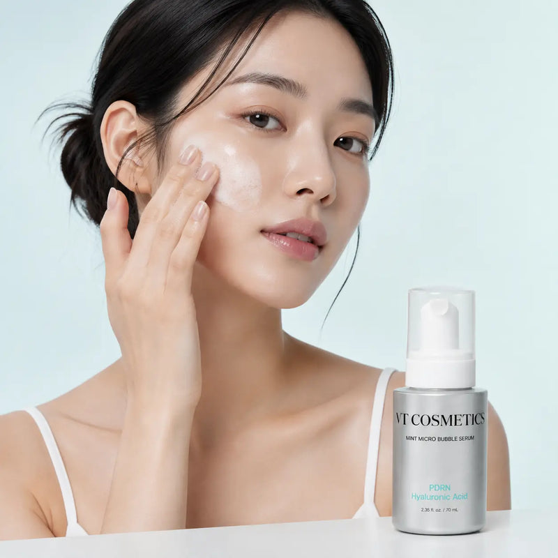 Applying VT Mint Micro Bubble Serum foam to the cheek